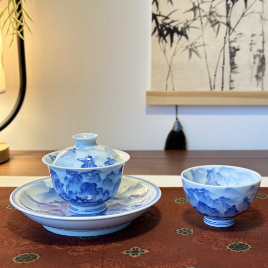 Hand-painted blue and white Jingdezhen gaiwan tea set with chicken-heart cup and saucer