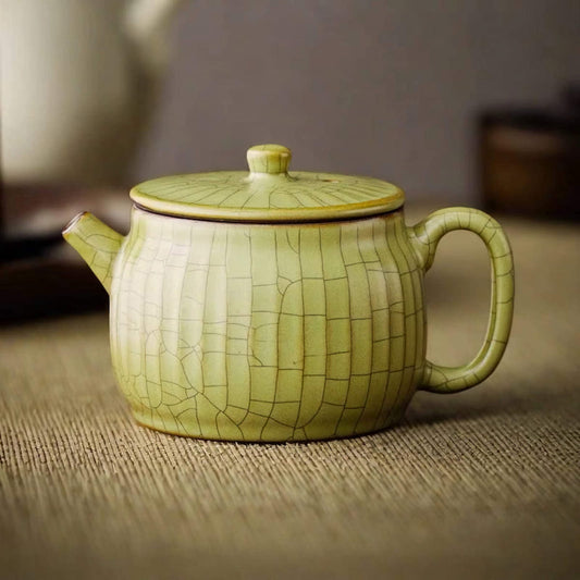 Ge Kiln wide-mouth teapot set, elegant Chinese ceramic design for brewing tea.