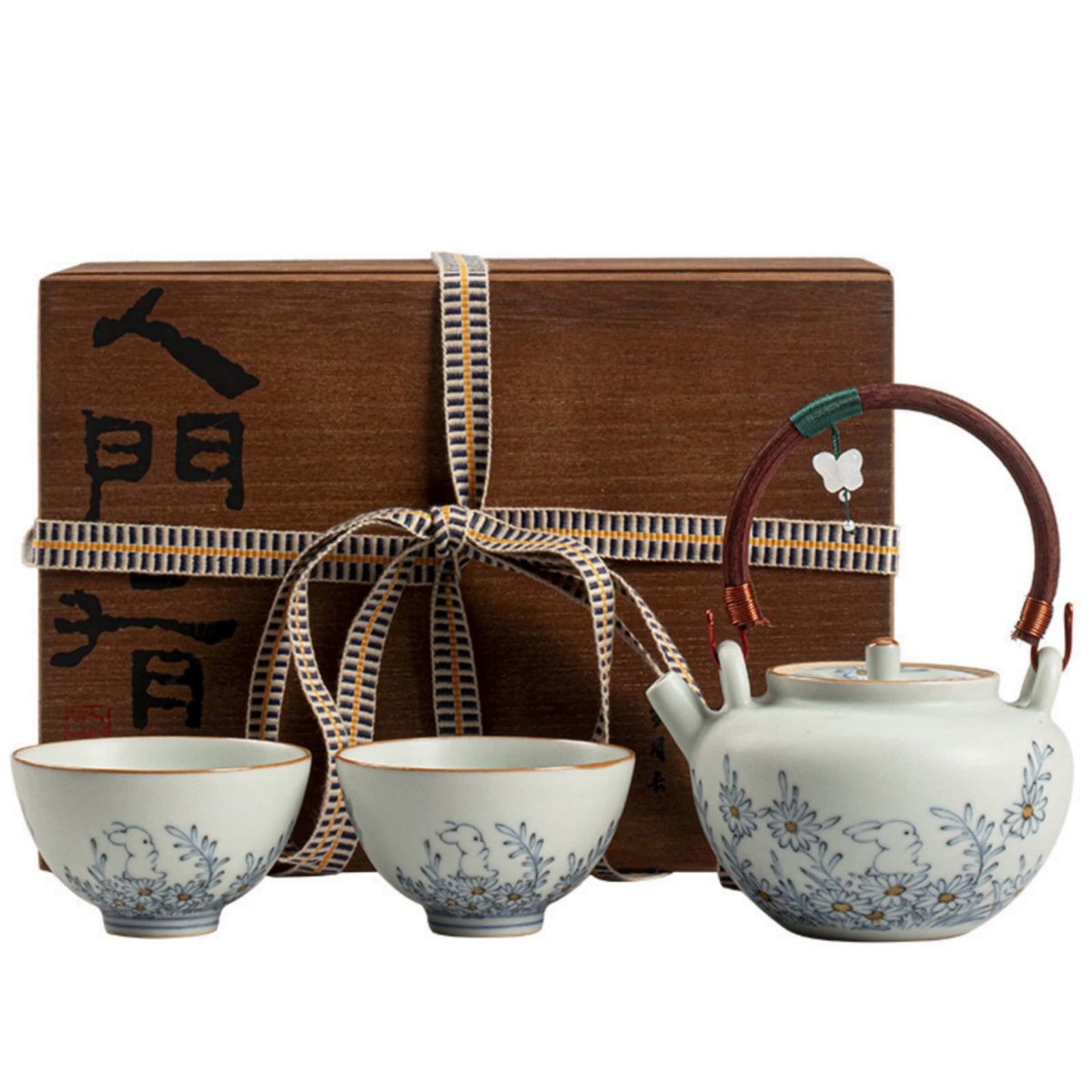 Underglaze blue porcelain teapot set with bamboo handle, matching cups, and wooden gift box