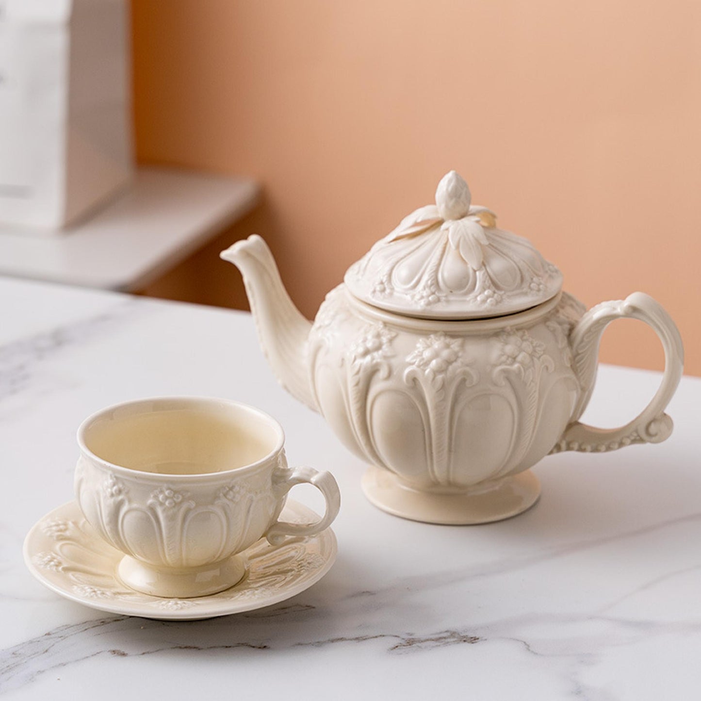 Handcrafted embossed porcelain vintage palace tea set with teapot, cup, and saucer for afternoon tea