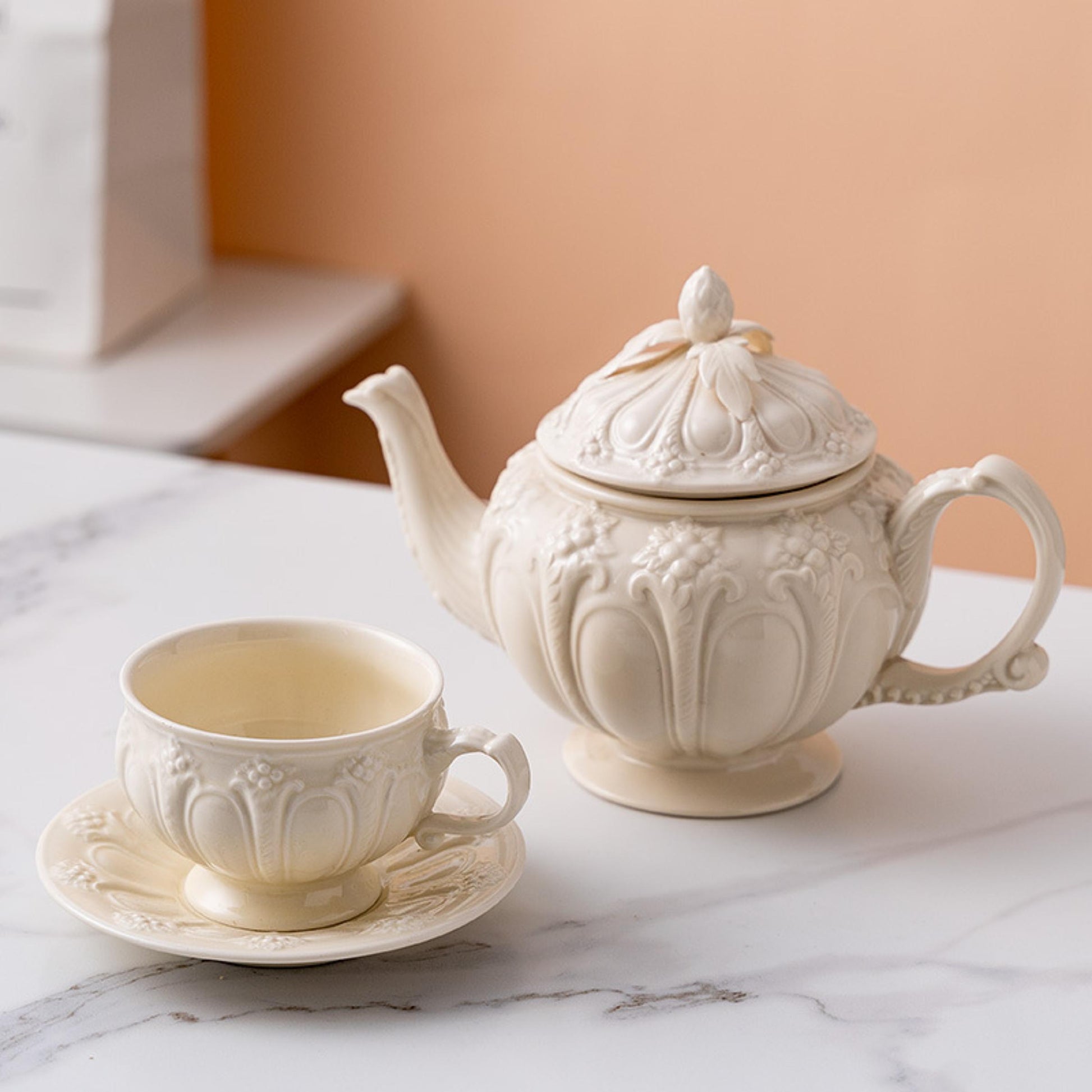 Handcrafted embossed porcelain vintage palace tea set with teapot, cup, and saucer for afternoon tea