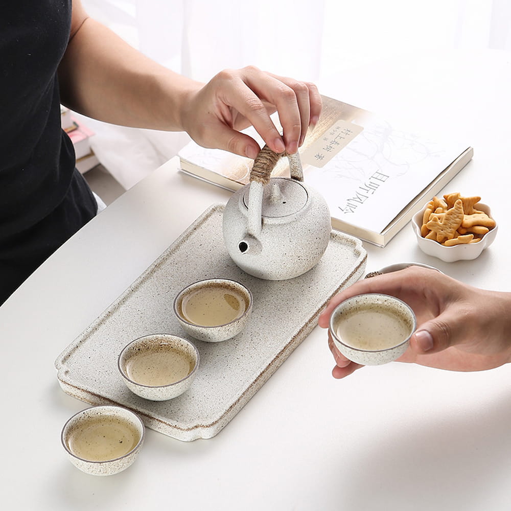 East Asian-style kiln-glazed ceramic tea set with teapot, tray, and cups for Gongfu tea ceremonies