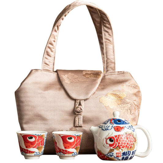 Portable porcelain gongfu travel tea set with teapot, two cups, and carry bag