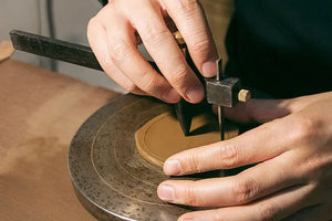 Cutting the clay slab to form the base and body sections