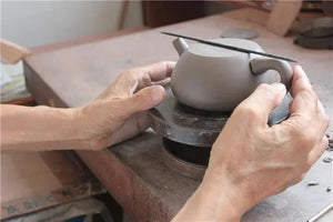 Refining the teapot shape and carving decorative patterns