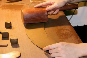 Rolling clay coils to prepare the teapot clay body