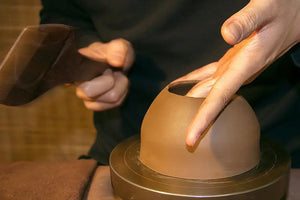 Shaping the teapot body cylinder and closing the mouth
