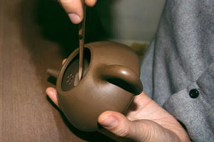 Trimming and refining the inner wall of the teapot